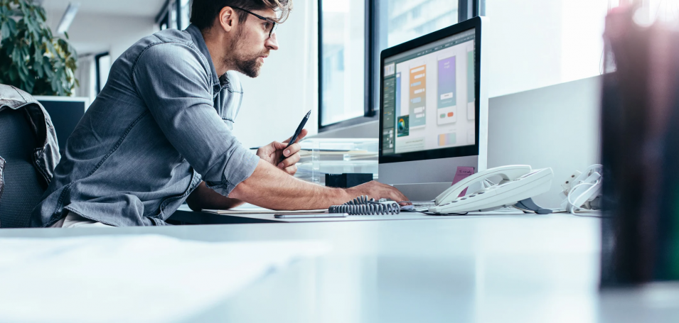 Man looking at a desktop