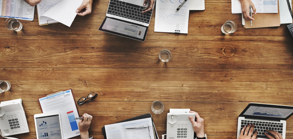 Laptops and notes on a conference table