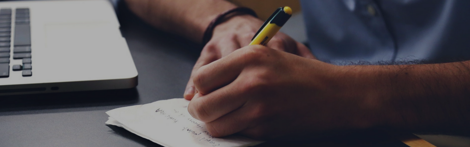 Hands writing notes