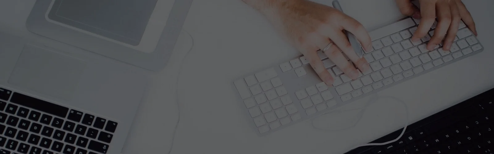 Hands typing on a keyboard