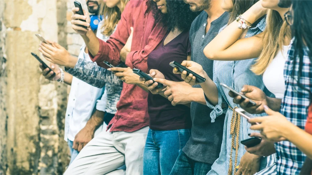 Group of friends on smartphones