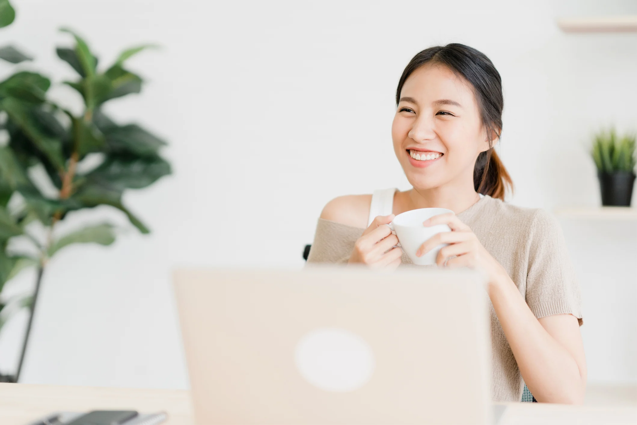 Woman holding a coffee cup