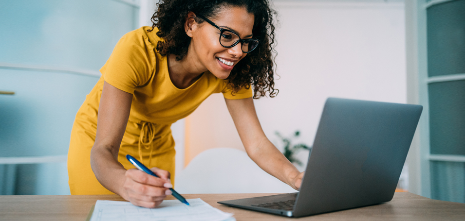 woman at laptop making a list